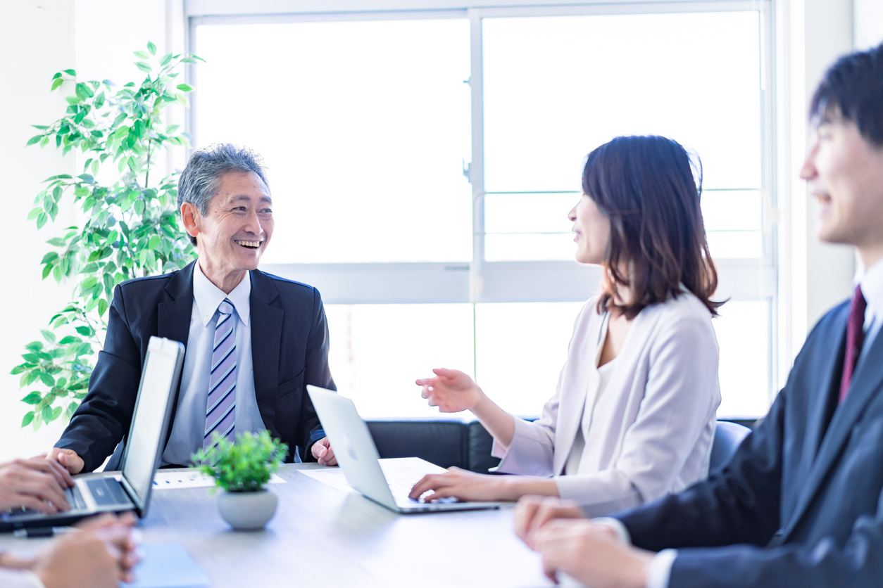 Senior manager speaking with a smile